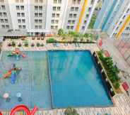 Swimming Pool 4 Cozy Studio Apartment at 11th Floor Paramount Skyline By Travelio