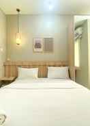 BEDROOM Minimalist Studio Apartment at 12th Floor Grand Kamala Lagoon By Travelio