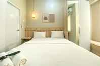 Kamar Tidur Minimalist Studio Apartment at 12th Floor Grand Kamala Lagoon By Travelio