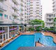 Swimming Pool 7 Homey and Modern Look 2BR Bogor Icon Apartment By Travelio