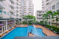 Swimming Pool Homey and Modern Look 2BR Bogor Icon Apartment By Travelio