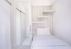 Bedroom 2 Modest 2BR Apartment at Jarrdin Cihampelas By Travelio