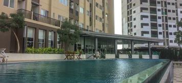 Swimming Pool 6 Fully Furnished with Luxury Design Studio Apartment at The Oasis By Travelio