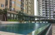 Swimming Pool 6 Fully Furnished with Luxury Design Studio Apartment at The Oasis By Travelio