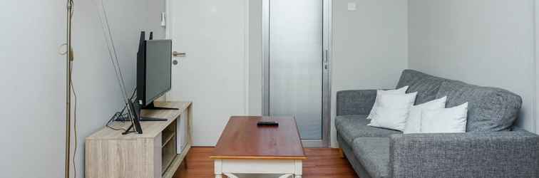 Lobi Minimalist and Cozy 2BR Apartment at Pakubuwono Terrace By Travelio