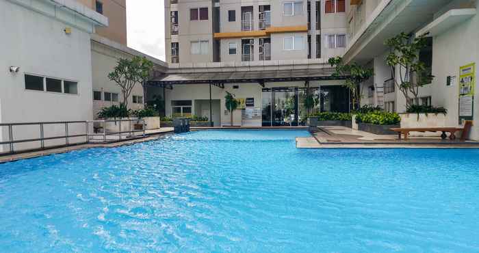 Swimming Pool Minimalist and Cozy 2BR Apartment at Pakubuwono Terrace By Travelio