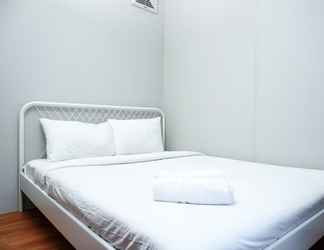 Bedroom 2 Minimalist and Cozy 2BR Apartment at Pakubuwono Terrace By Travelio