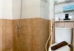 In-room Bathroom 4 Comfortable and Modern Look 2BR Green Pramuka City Apartment By Travelio