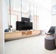 Lobby 3 Beautiful and Minimalist 1BR with Extra Room at Pavilion Permata Apartment By Travelio