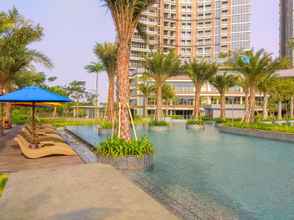 Swimming Pool 4 Cozy and Exclusive 1BR at Gold Coast Apartment By Travelio