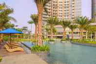 Swimming Pool Cozy and Exclusive 1BR at Gold Coast Apartment By Travelio