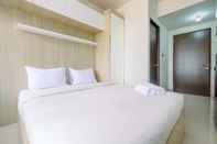 Bedroom Fully Furnished with Cozy Design Studio Apartment at Transpark Cibubur By Travelio