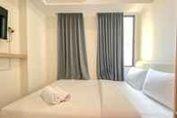 Kamar Tidur Simply Look Studio Apartment at Osaka Riverview PIK 2 By Travelio