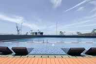 Swimming Pool Simply Look Studio Apartment at Osaka Riverview PIK 2 By Travelio