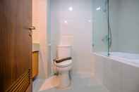 In-room Bathroom Spacious and Cozy Living Studio at 28th Floor Kemang Village Apartment By Travelio