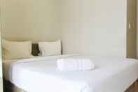 Bedroom Minimalist 1BR Apartment with City View at The Mansion Kemayoran By Travelio