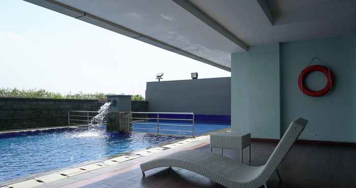 Swimming Pool Combined Unit 1BR Apartment with Extra Room at Belmont Residence Puri By Travelio