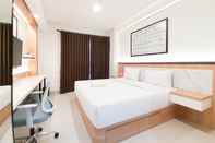 Bedroom Cozy Designed Studio Apartment at Patraland Amarta By Travelio