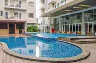 Swimming Pool Simply Look and Homey Studio Room at Bogor Icon Apartment By Travelio