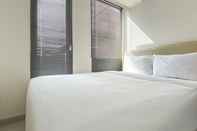 Kamar Tidur Simply and Cozy Studio Room at Osaka Riverview PIK 2 Apartment By Travelio