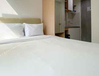 Kamar Tidur 2 Tidy and Restful Studio at Osaka Riverview PIK 2 Apartment By Travelio