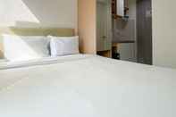 Kamar Tidur Tidy and Restful Studio at Osaka Riverview PIK 2 Apartment By Travelio