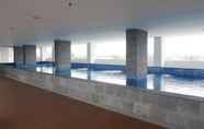 Swimming Pool 6 Minimalist Studio Room at Poris 88 Apartment By Travelio