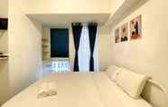 Kamar Tidur 3 Enjoy and Homey Living Studio Tokyo Riverside PIK 2 Apartment By Travelio