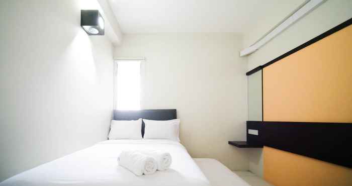 Bedroom Comfy and Homey 2BR at Dian Regency Apartment By Travelio