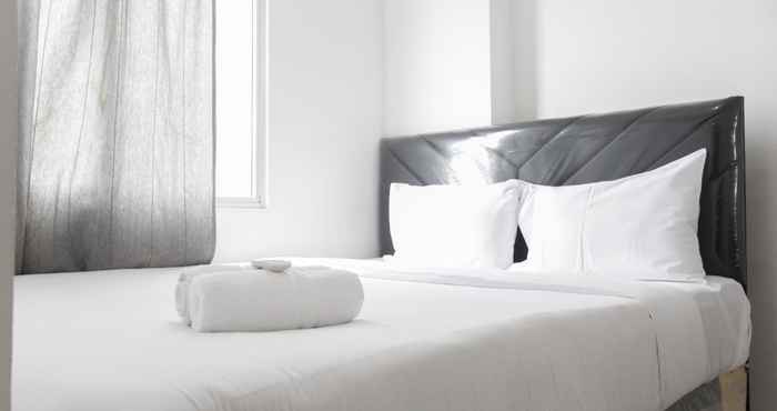 Bedroom Enjoy and Minimalist 2BR at Bassura Apartment near Bassura Mall By Travelio