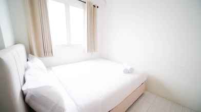 Bedroom 4 Tidy and Best Choice 2BR at Puncak Dharmahusada Apartment By Travelio