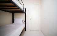 Bedroom 7 Homey and Best Location 2BR at Twin Tower Apartment By Travelio