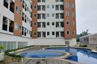 Kolam Renang Simply Look and Warm Studio Room Apartment Urban Heights Residences By Travelio