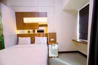 Kamar Tidur Cozy Studio Apartment at 25th Floor Vida View Makassar By Travelio