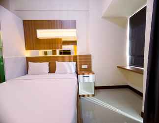 Bedroom 2 Cozy Studio Apartment at 25th Floor Vida View Makassar By Travelio