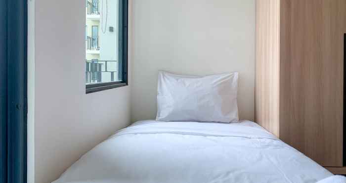 Bedroom Minimalist Studio Apartment at 20th Floor Osaka Riverview PIK 2 By Travelio