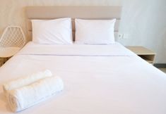 Bedroom 2 Cozy Stay and Good Studio Connected with Mall at Supermall Mansion Apartment By Travelio