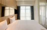 Bedroom 7 Elegant and Good Deal Studio Vasanta Innopark Apartment By Travelio