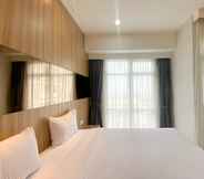 Bedroom 7 Elegant and Good Deal Studio Vasanta Innopark Apartment By Travelio