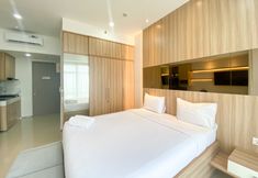 Bedroom 5 Elegant and Good Deal Studio Vasanta Innopark Apartment By Travelio