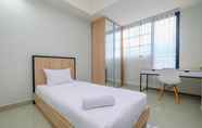 Bedroom 2 Minimalist Studio Room Apartment at Evenciio Margonda By Travelio