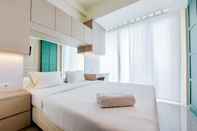 Bedroom Cozy Stay Studio Apartment at Tree Park City BSD By Travelio