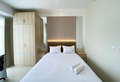 Bedroom 2 Comfy and Best Choice Studio Vasanta Innopark Apartment By Travelio