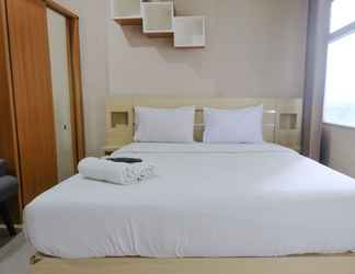 Bedroom 2 Homey Studio Apartment at 1st Floor Grand Asia Afrika By Travelio