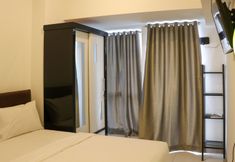 Bedroom 7 Simply and Comfy Studio Tokyo Riverside PIK 2 Apartment By Travelio