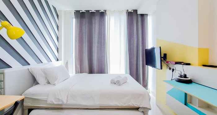 Bedroom Minimalist Studio Apartment at Tree Park City BSD By Travelio