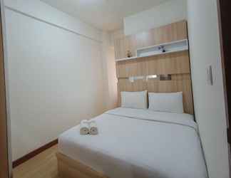 Bedroom 2 Classic and Tidy 2BR at Vida View Makassar Apartment By Travelio
