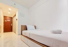침실 2 Homey and Warm Studio Apartment at Sky House BSD By Travelio