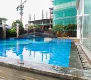 Swimming Pool 7 Spacious and Tidy 2BR at Grand Sungkono Lagoon Apartment By Travelio