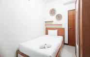 Bedroom 2 Comfortable and Spacious 3BR Vida View Makassar Apartment By Travelio